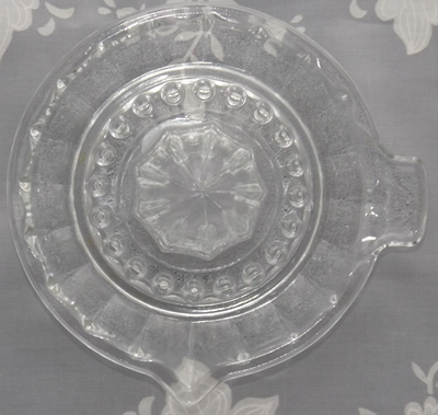 Top view of a Reims, France 20 panel clear glass juicer