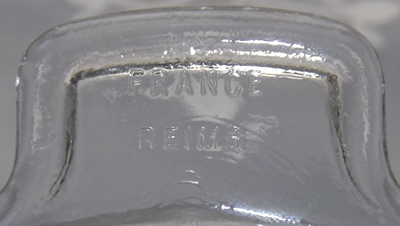 The "REIMS FRANCE" on a 20 panel clear glass juicer 