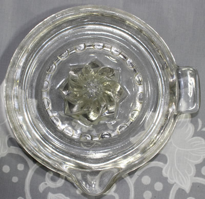 Top view of a U.S. Glass Company spiral reamer clear glass juicer