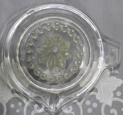 Circle around reamer on a clear glass juicer