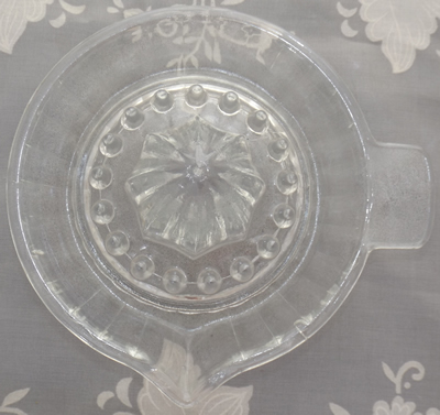 Top view of a small cone clear glass juicer