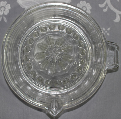 Top view of banded clear glass juicer 
