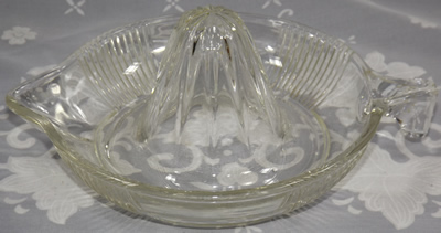 Clear glass juicer showing tear drop handle