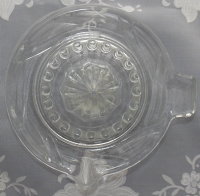 Swirl pattern clear glass juicer top view