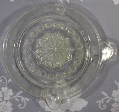 Top view of a Crown Crystal Glass clear glass smaller juicer