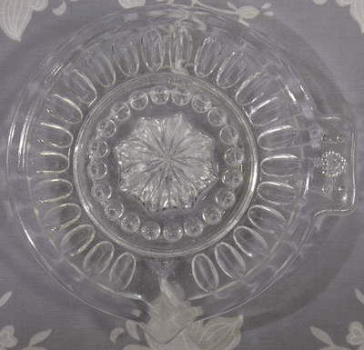 Heart on tab handle clear glass juicer