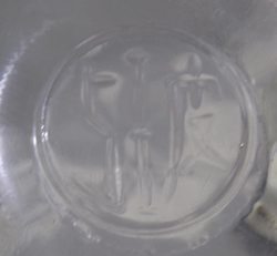 Unusual script embossed maker's mark on clear glass 2 piece