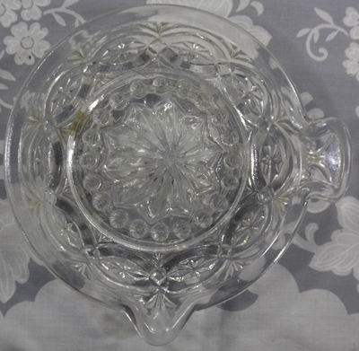 Clear glass juicer with rounded handle top view