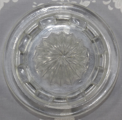 Clear glass slotted juicer top view