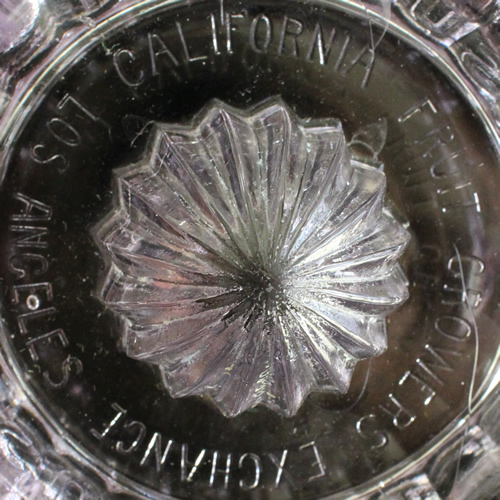 Embossed CALIFORNIA FRUIT GROWERS EXCHANGE LOS ANGELES on base of Pacific Coast Glass Works clear glass SUNKIST juicer