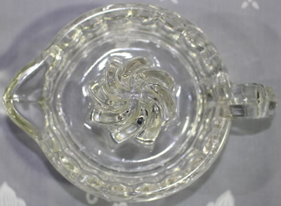 U.S. Glass Company clear glass juicer with spiral reamer  top view