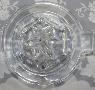 Top view of Hazel Atlas saucer shape clear glass juicer