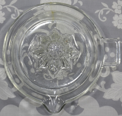Top view of Shallow bowl saucer shape clear glass juicer