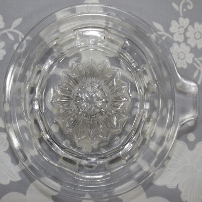 Top view of a large Anchor Hocking clear glass 2 piece reamer