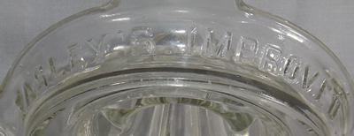 Embossed Easley's improved patent clear glass juicer