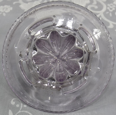 Bottom view of a Indiana Glass Co. Easley's patent clear glass reamer 
