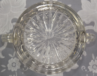 The base of the cup for a clear glass 2 piece juicer with 2 loop handles