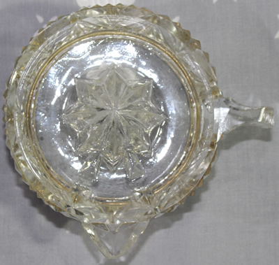 Top view of silver rim on base of a French crystal juicer
