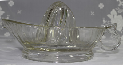 Side view of a loop handle Jeannette Glass Company clear glass juicer 