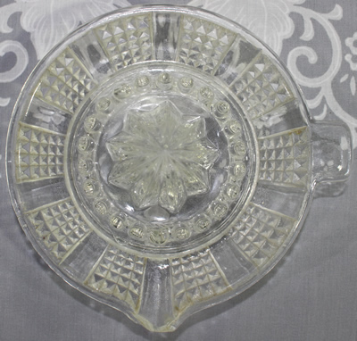 Top view of a panels of pyramids clear glass juicer 