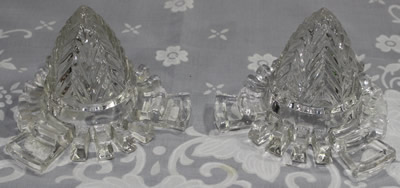 Both the embossed and unembossed version of the C. H. Read clear glass 'Juice Extractor'