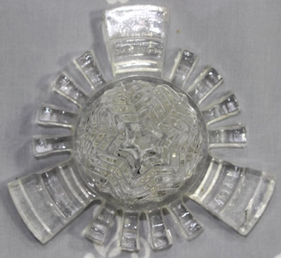 Top view of an embossed C. H. Read clear glass 'Juice Extractor'