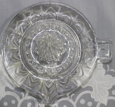 Top view of a Gebedje clear glass saucer juice