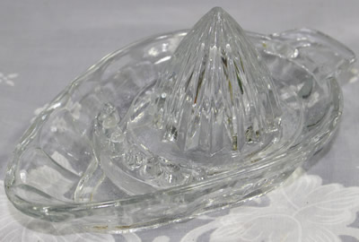 A view of a seed dam clear glass egg shape juicer 