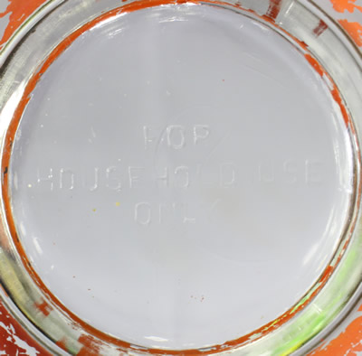 Base of a U.S. Glass Company Clear - red base Decorated juicer 