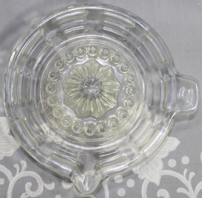 Top view of a MADE IN CZECHOSLOVAKIA saucer shape clear glass juice