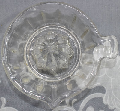 Top view of a small 15 panel clear glass juicer