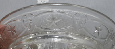 The stars in loops pattern on a clear glass juicer