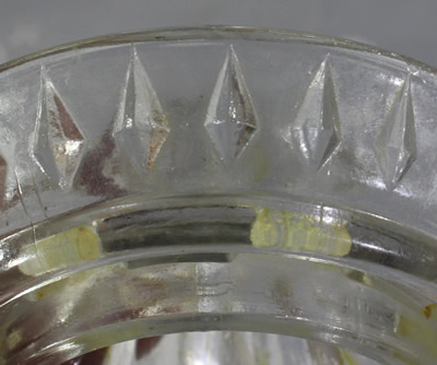 The diamonds around a clear glass juicer top 
