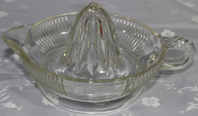 Anchor Hocking Glass Company clear glass ribbed juicer