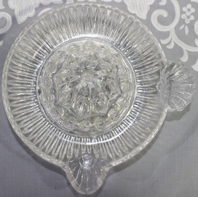 Top view Fan handle clear glass saucer juicer