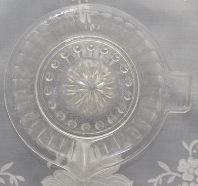 Top view of a 11½ cm clear glass panelled juicer