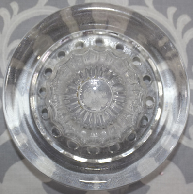 The reamer for a Westmoreland Specialty Co. clear glass 2 piece cup juicer