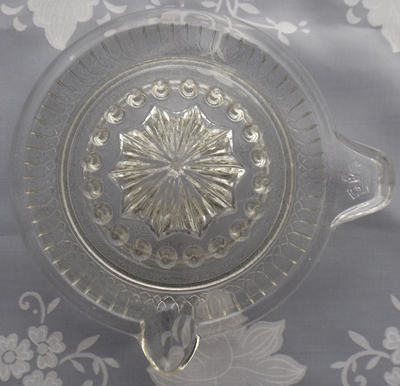 Crown on tab clear glass juicer top view'