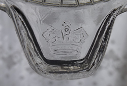 Tab showing Crown on clear glass juicer