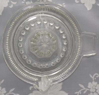 Top view of a British Made closely ribbed clear glass juicer