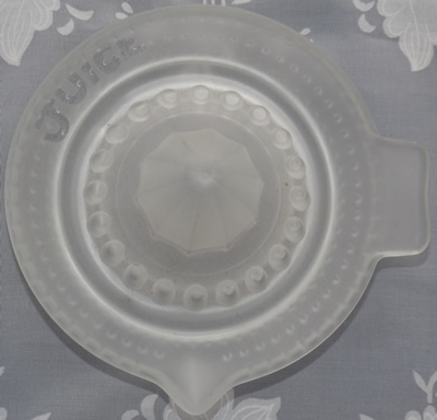 Top view of a f rosted 'JUiCE' hobnail glass juicer
