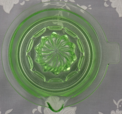 Top view od a green Hazel Atlas saucer spiral juicer