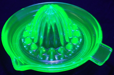 Green Jeannette Glass saucer juicer under UV light