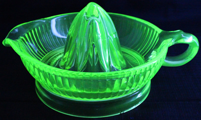Large Anchor Hocking lime green glass juicer under UV light