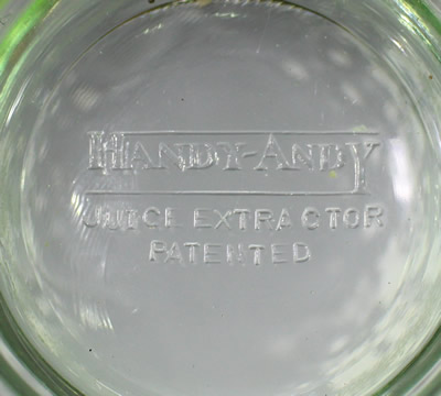 The embossed base on the U.S.Glass Co. Handy Andy Green glass juicer