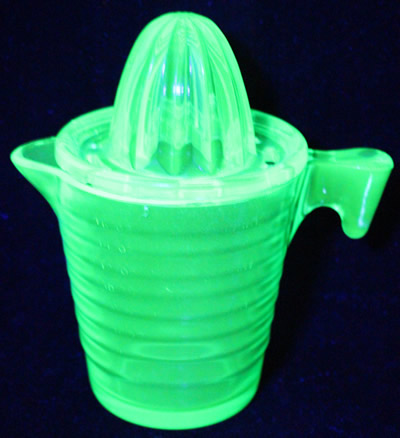 U.S. Glass Green glass ribbed juicer jug set under UV light