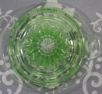 Top view of a reamer for a 1 pint Crown Crystal green uranium glass juicer jug set