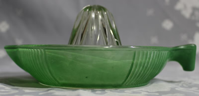 Side view of a Crown Crystal Australia fired on green tear drop handle juicer
