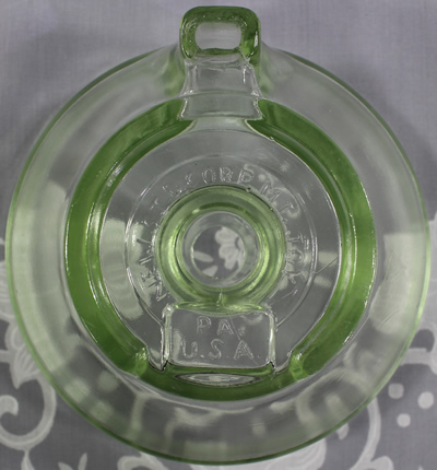 Bottom view of a Mount Joy green glass juicer attachment