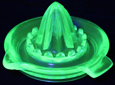Green Uranium glass juicer with flat top pip collectors under UV light